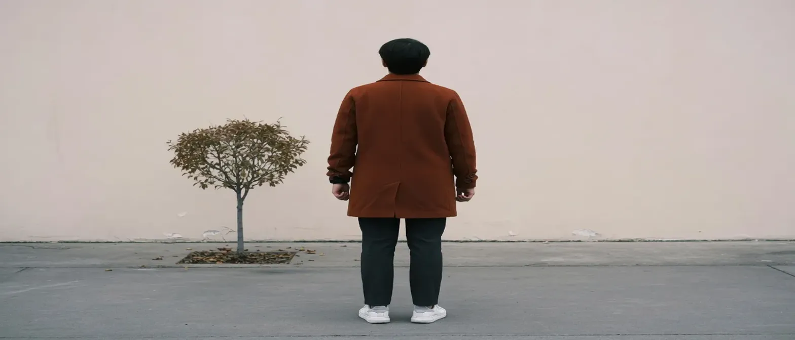 The same person stretched from 3:2 into 21:9, so they look much shorter and wider.